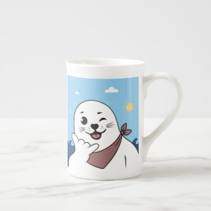 Taza De Porcelana Foca guiñando con pañuelo en la cabeza haciendo el