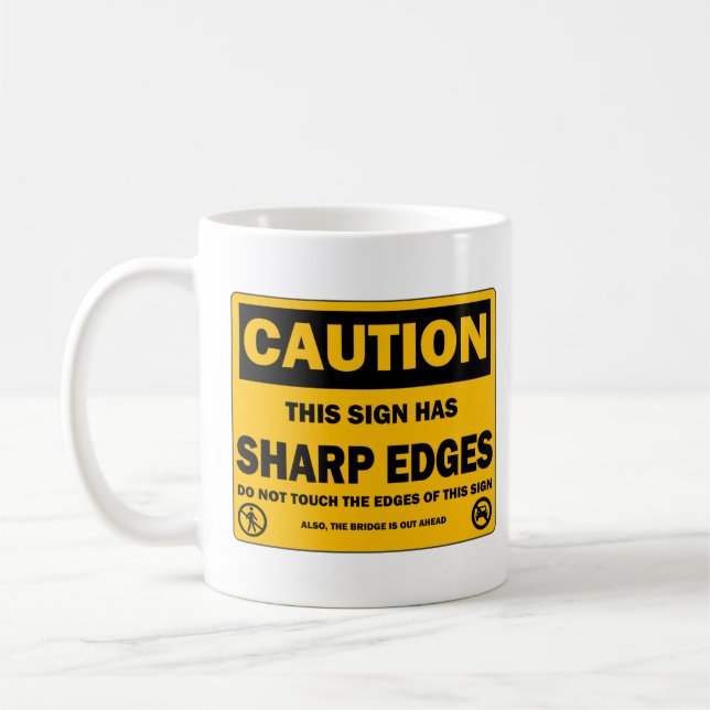 Taza del aviso de la precaución (Izquierda)