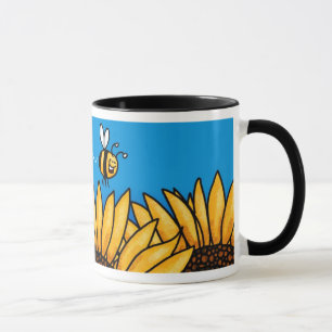 taza del girasol del rastro de la abeja