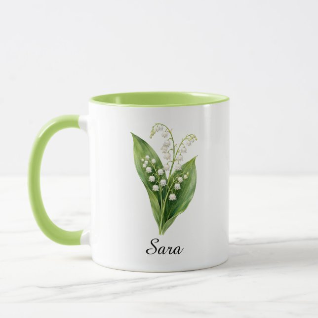 Taza del lirio de mayo de cumpleaños (Izquierda)