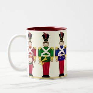 Taza del navidad de los soldados de juguete