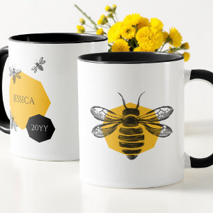 Taza del nombre del año del panal de abeja amarill