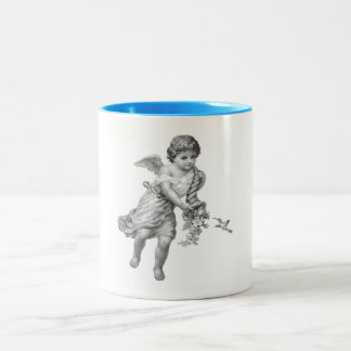Taza del pájaro del ángel y del tarareo