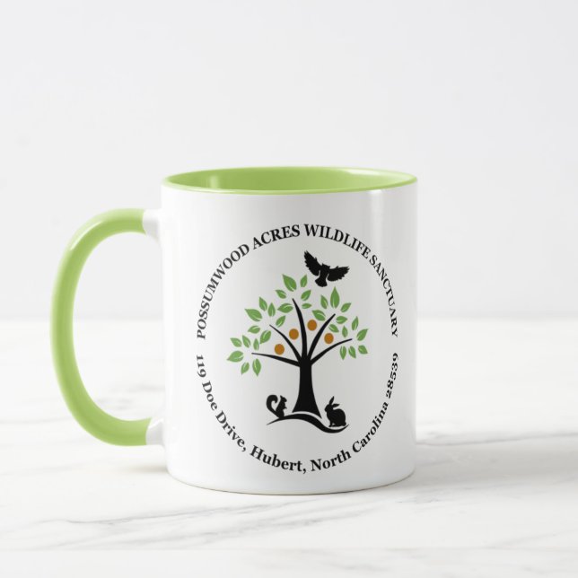 Taza del santuario de fauna de los acres de (Izquierda)