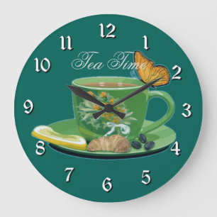 Taza del tiempo del té y reloj de pared del