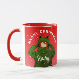 Taza Dibujo de niña con capucha de rana verde en Navida
