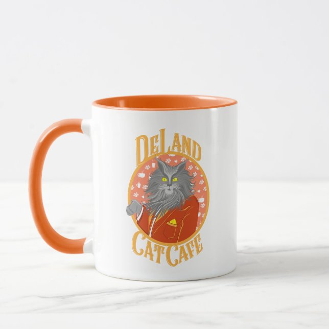 Taza El logo de Henry DeCat Cafe de DeLand con traje de (Izquierda)