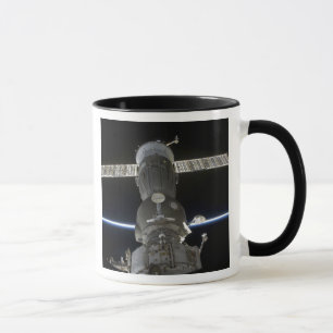 Taza El miembro de la tierra entrecruza una nave