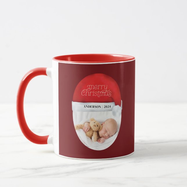 Taza Feliz Navidad Red Santa Hat Baby Holiday (Izquierda)