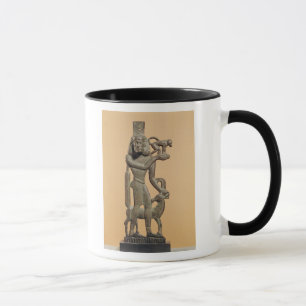 Taza Figura de un hombre que sostiene un mono