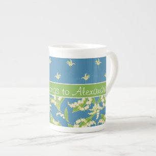 Taza floral de la porcelana de hueso del lirio de