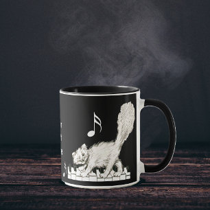 Taza Gato blanco en las llaves del piano