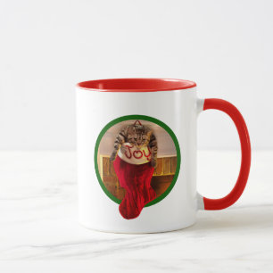 Taza Gato gordo en el almacenamiento del navidad
