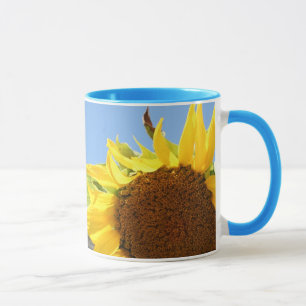 Taza Girasol y cielos azules