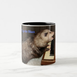 Taza grande con el oposum del canto