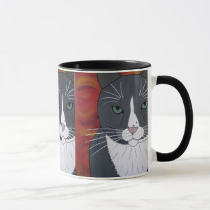 Taza gris de la cara del gato