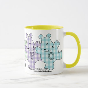 Taza Guinga feliz del pastel de los hipopótamos