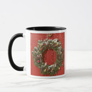Taza Guirnalda del navidad que cuelga en una puerta