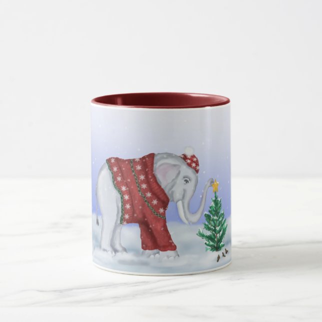 Taza hecha punto del suéter del elefante a (Centro)