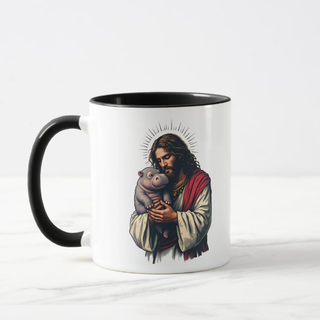 Taza Jesús sostiene a un bebé Moo Deng Hippo (Izquierda)