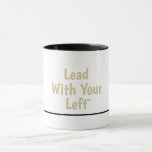 Taza Lead With Your Left - Ceramic Mug w/Black Accents<br><div class="desc">Begin your day with a fresh perspective! This charming mug showcases the inspiring 'Lead With Your Left' message in gentle gold lettering on a bright white background, complemented by a sleek black handle and interior for a contemporary touch. Perfect for left-handed creators, students, or anyone who leads with purpose. It's...</div>
