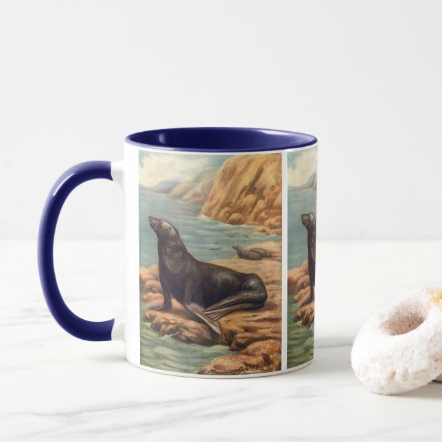 Taza León Marino junto a la orilla del mar, Mamíferos M (Con donut)