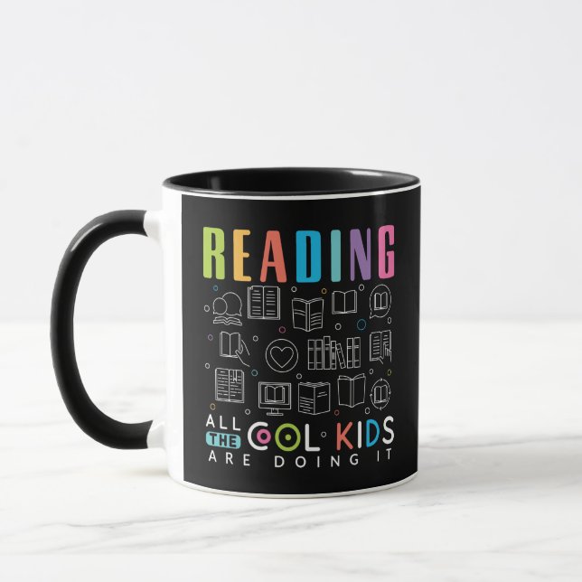 Taza Leyendo a todos los chicos geniales lo están hacie (Izquierda)