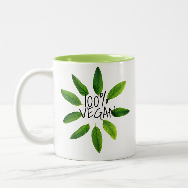 Taza libre del vegano de la crueldad, VEGANO 100% (Izquierda)