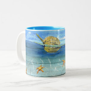 Taza linda de las estrellas de mar para el amante