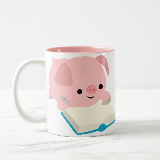 Taza linda del cochinillo de la lectura del dibujo (Izquierda)