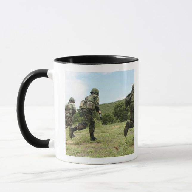 Taza Los Marines Reales Tailandeses se apresuran a aseg (Izquierda)