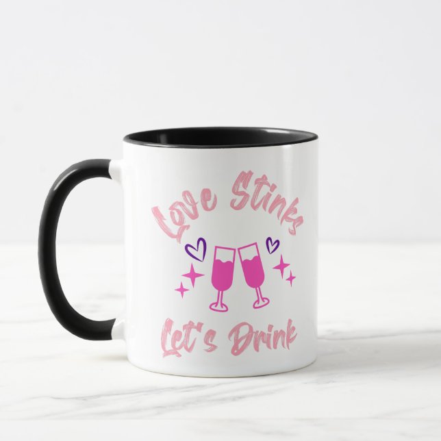 Taza Love Stinks Lets Drink (Izquierda)