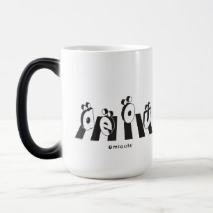 Taza Mágica “Los Umlauts™ Cruzando”