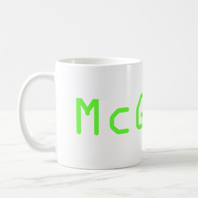 Taza McGeek de la show televisivo de NCIS (Izquierda)