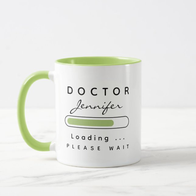 Taza MÉDICO [Nombre] Cargando verde claro y blanco (Izquierda)