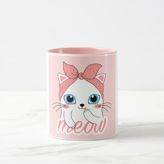 Taza Meow Cat (A white mug with a pink interior and a pink exterior features a cartoon illustration of a white cat.)
