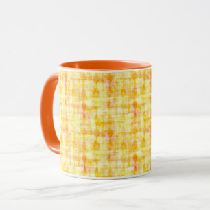 Taza Mugre amarillo y naranja al sol