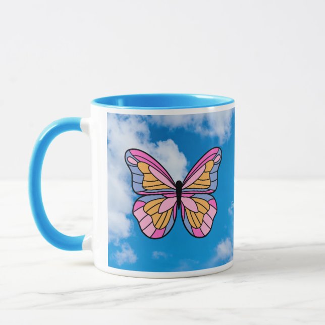 Taza Mugre azul de mango de mariposa rosa (Izquierda)