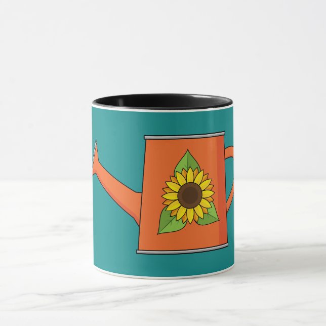 Taza Naranja regando lata con girasol (Centro)
