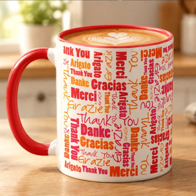Taza Naranja Rojo Gracias Multilingüe (Red and orange thank you word cloud designed 11 ounce coffee filled ceramic mug on table.)