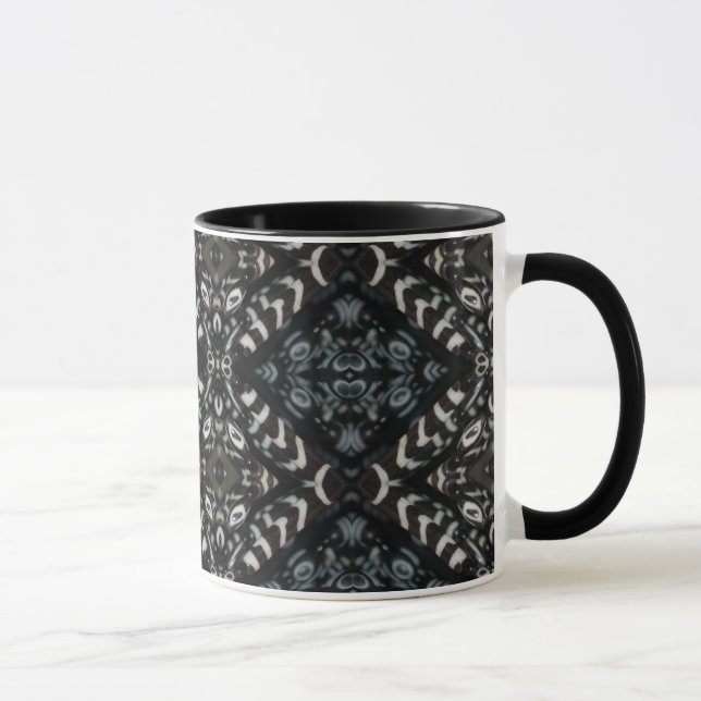 Taza negra del diseño (Derecha)