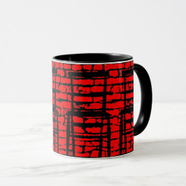 Taza negra y roja de la pared de ladrillo