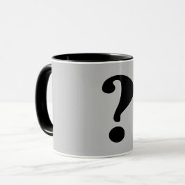 Taza Negro "Qué" sobre fondo Gris Claro