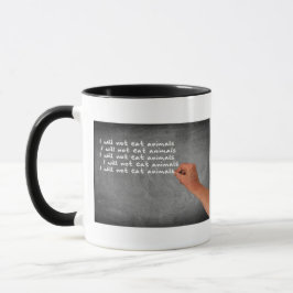 Taza No comeré animales escrito en la pizarra