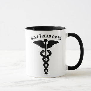 Taza No pise en nosotros el caduceo