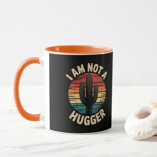 Taza No soy de los que dan abrazos (Con donut)