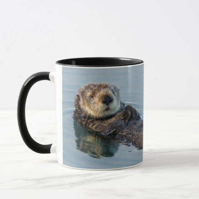 Taza Nutria marina flotando de espaldas en el océano (Izquierda)