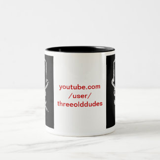 Taza oscura del logotipo de tres viejos tipos