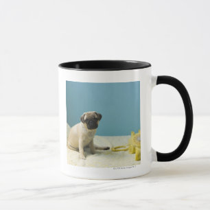 Taza Perrito del barro amasado que se sienta en cama al
