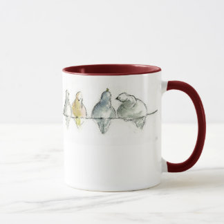 Taza pidgeons en un alambre